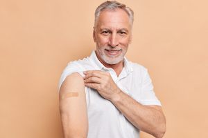 Senior man getting flu shot