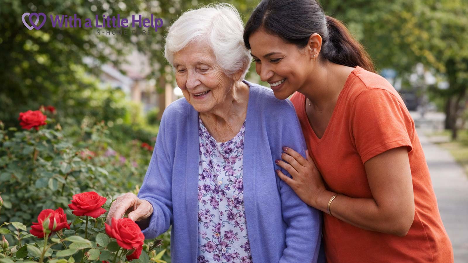 Senior caregiver supporting an older woman during a peaceful walk in the garden