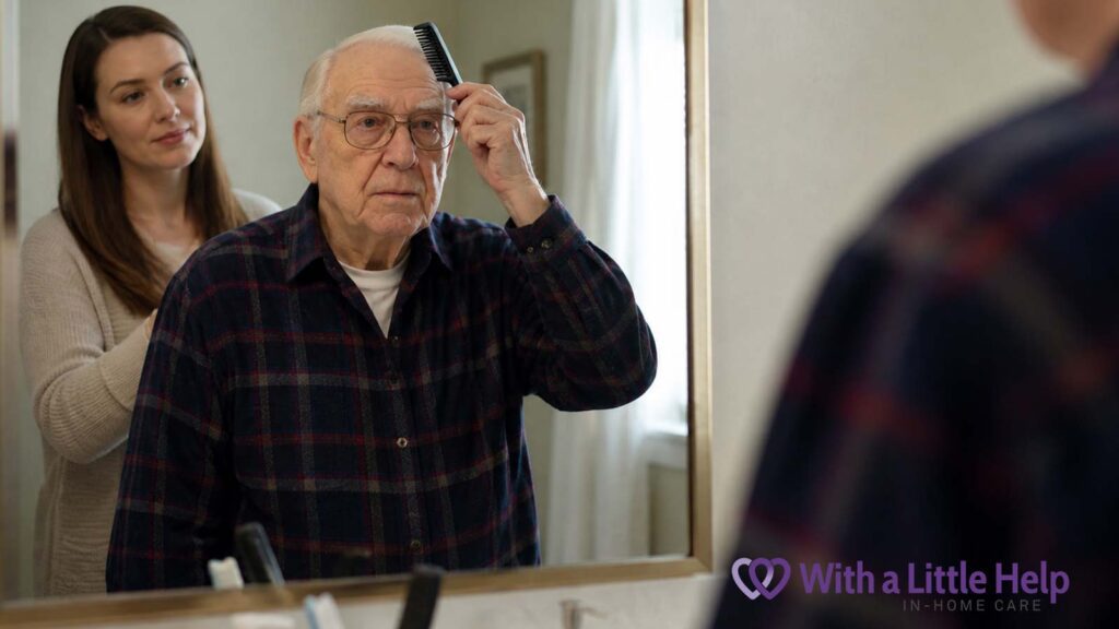Elderly man brushing hair in mirror with caregiver nearby during daily care at home