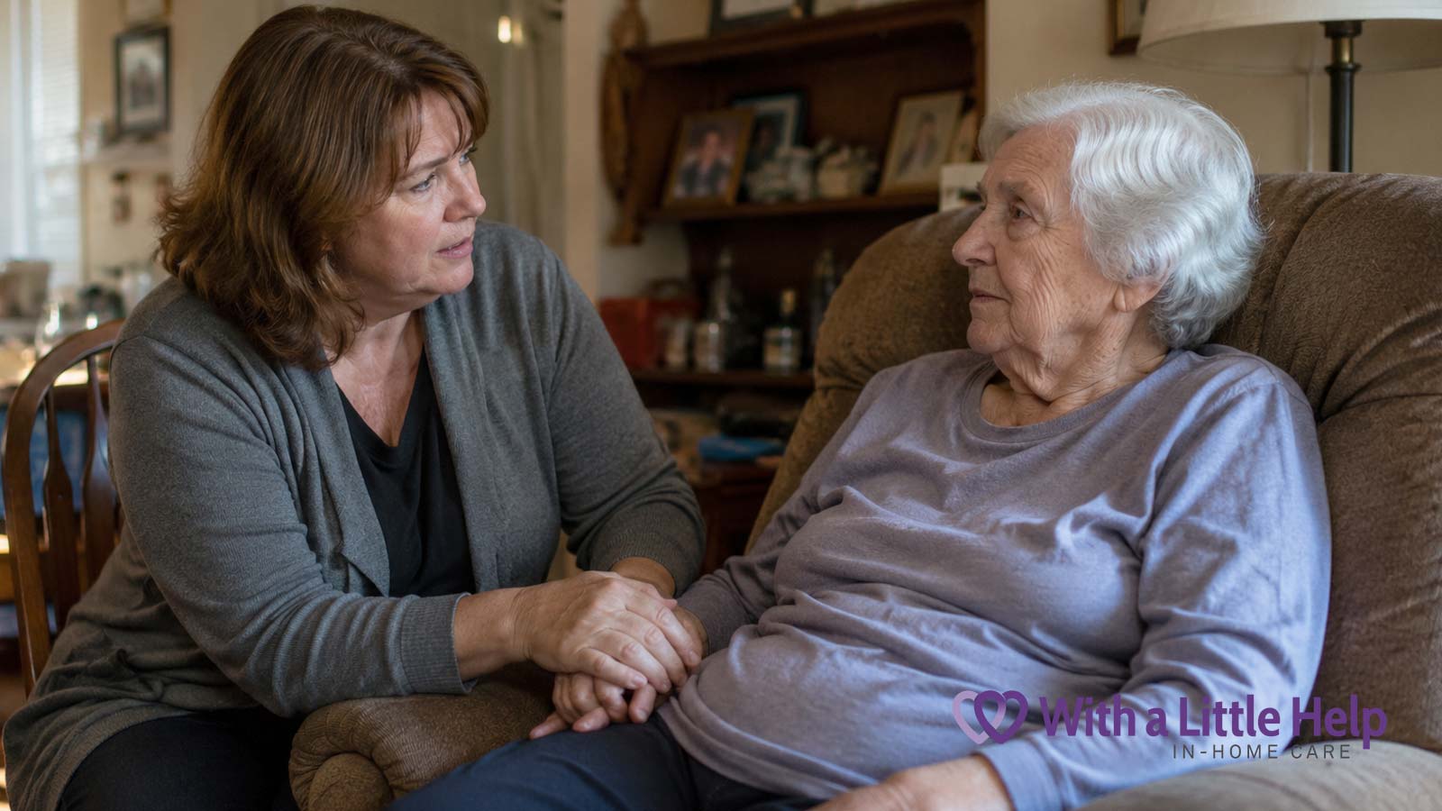 Adult daughter introducing the idea of help at home while sitting beside her elderly mother