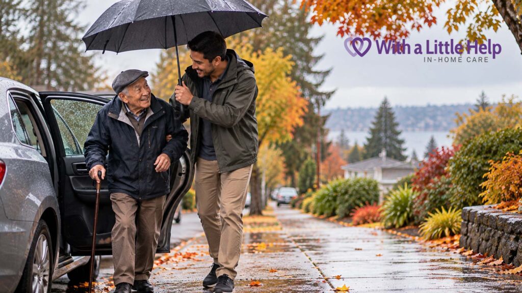 Parkinson’s in-home care in Seattle helps an elderly Asian man with a cane get to a car on a rainy day with assistance from his caregiver.